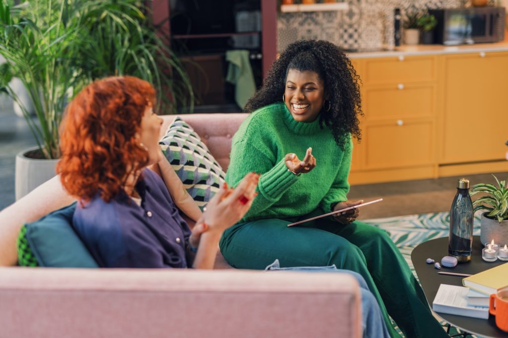 a woman and a man sitting on a couch