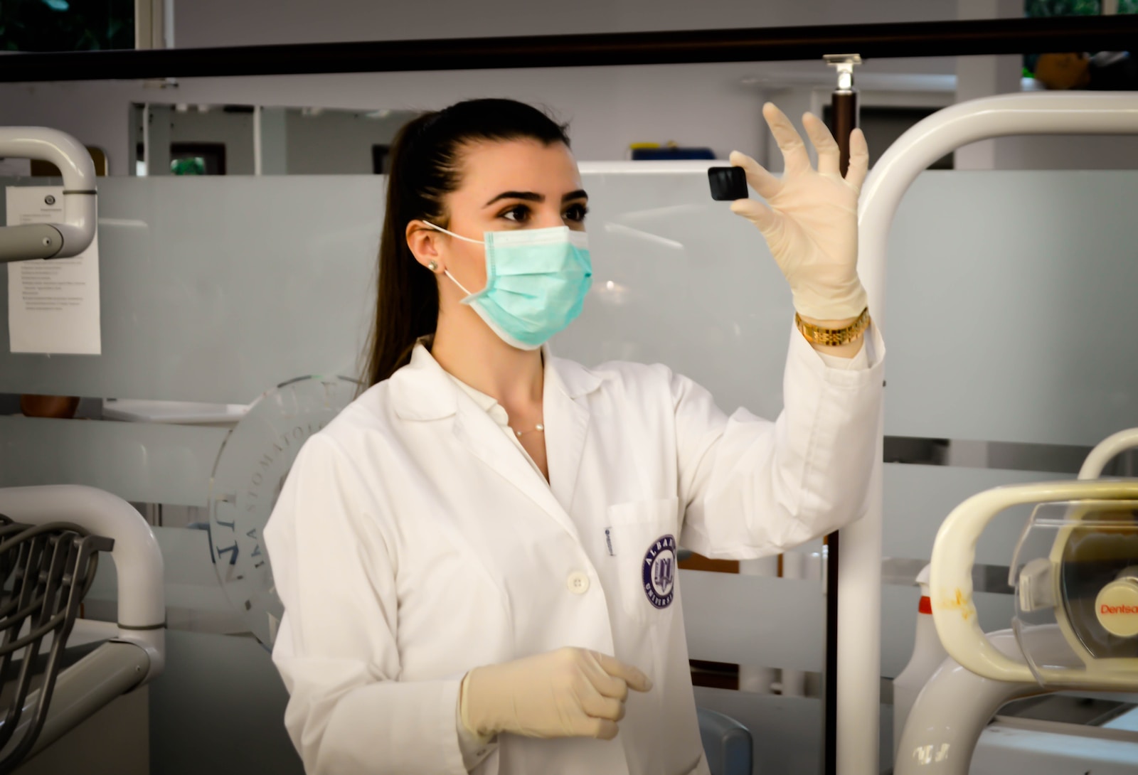 A woman holding up a test tube.